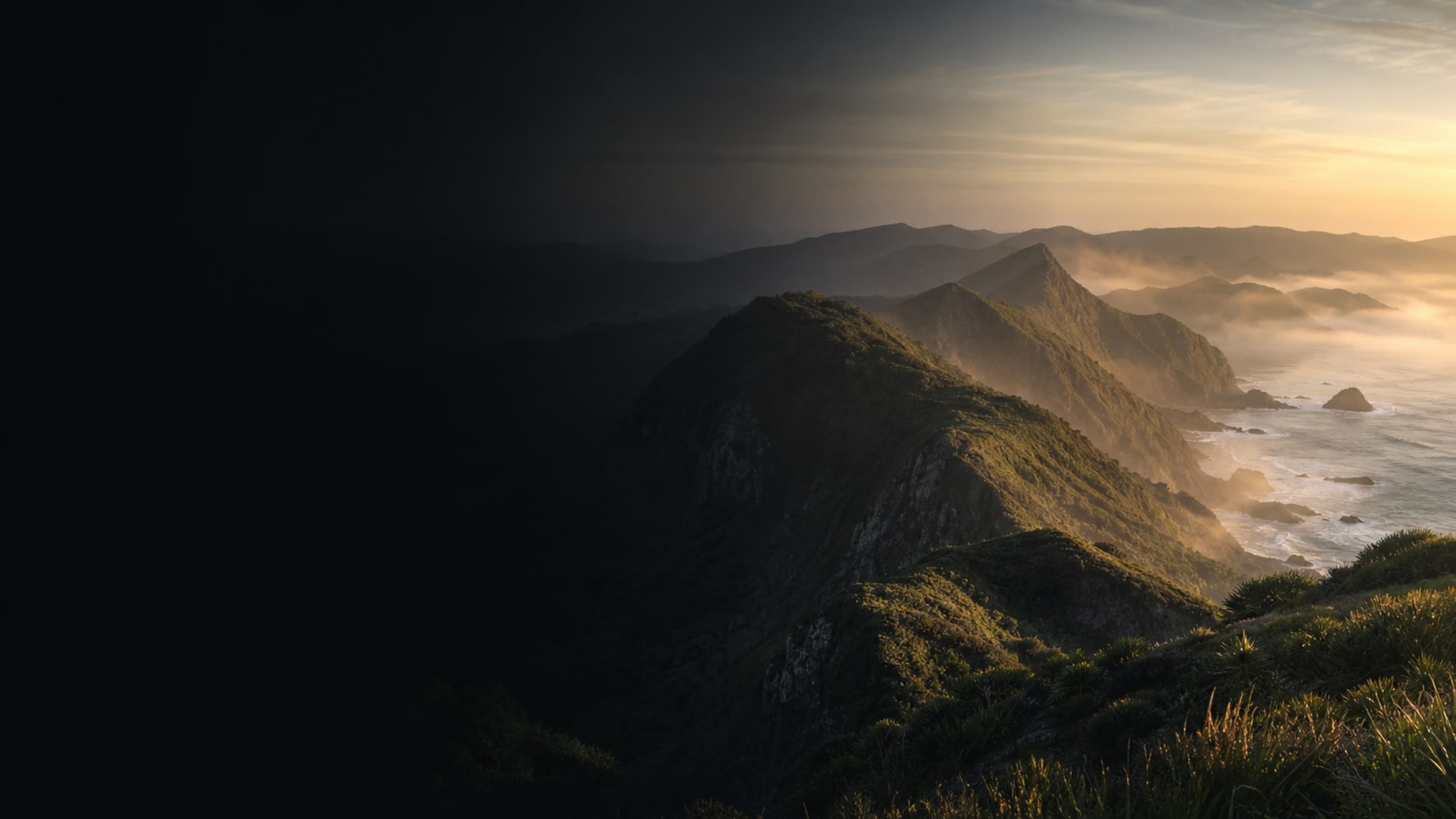Te Tai Tokerau coastal ridgeline at first light — Stone AI's solid-ground motif